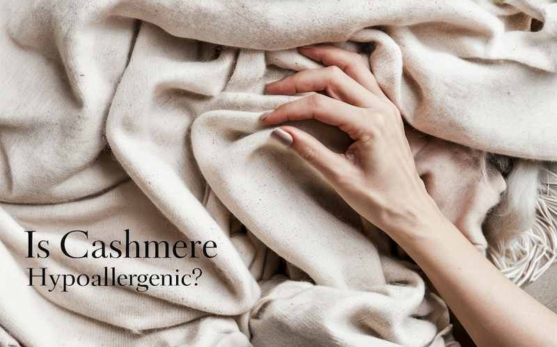 Is cashmere hypoallergenic? picuture of a womans hand feeling the cashmere material